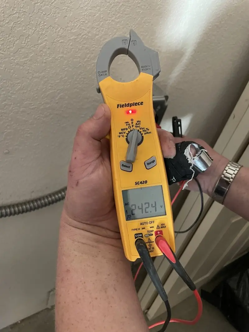 Voltage testing with clamp meter during Whole House Surge Protector in Upper Pottsgrove